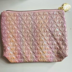 Too Faced makeup bag with mascara and lip plumper